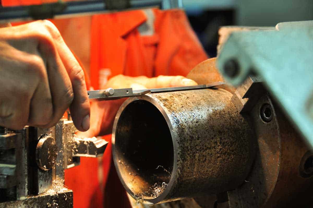 Lathe machine in a workshop, Part of the lathe. Lathe machine is operation on the work shop.